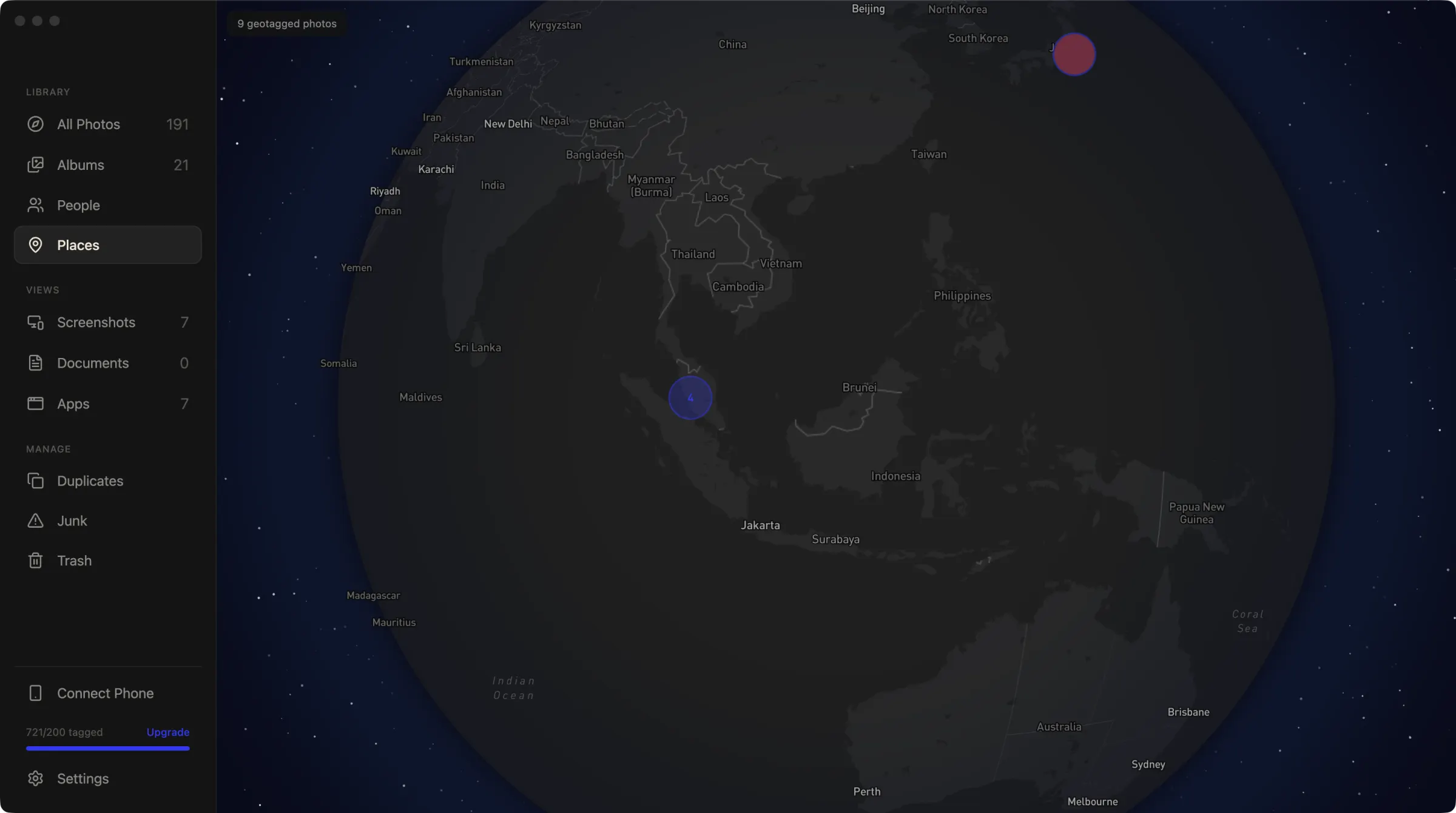 Binky's places view. A dark globe over Southeast Asia with photo clusters.